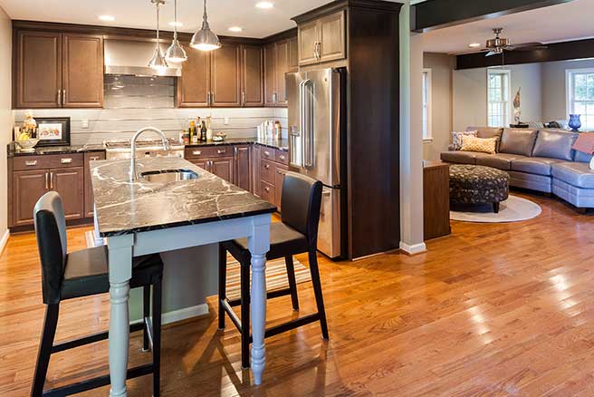 Monkton Kitchen Remodeled with dark wood cabinets and a furniture style island