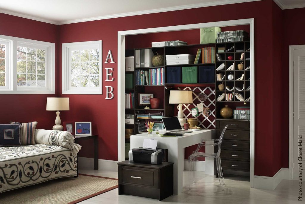 Guest room with a home office extending from unused closet space and a day bed for guests