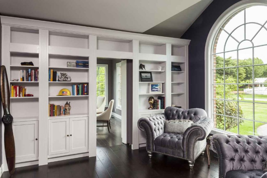 Home library with a secret passage to an office space.