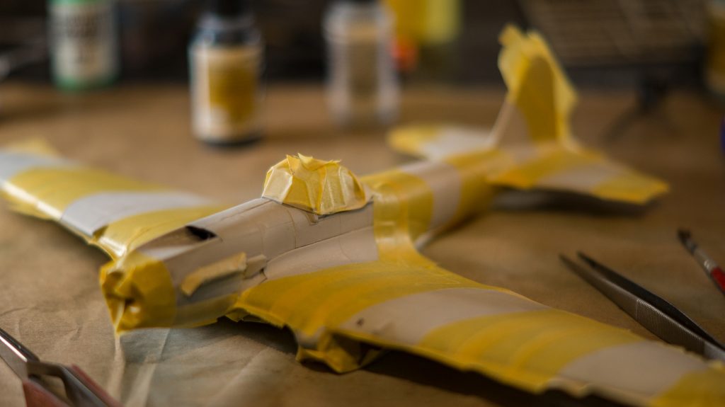 Model plane being painted