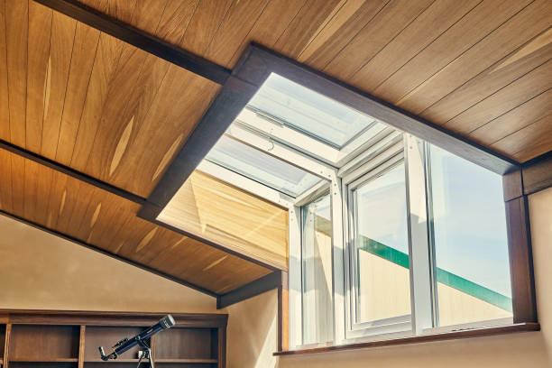 Wood plank ceiling with large window viewing forward and up.