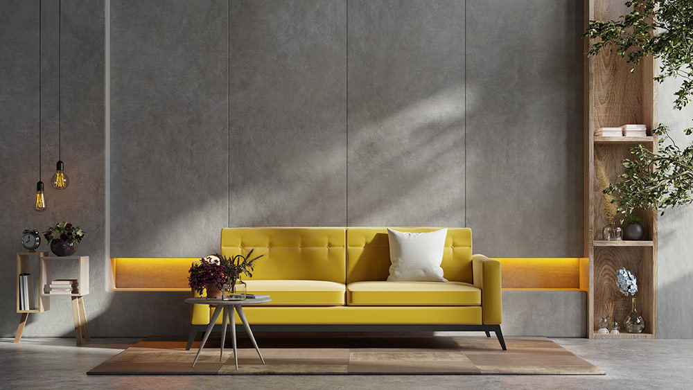 Living room with concrete flooring, minimal decor, and a yellow sofa