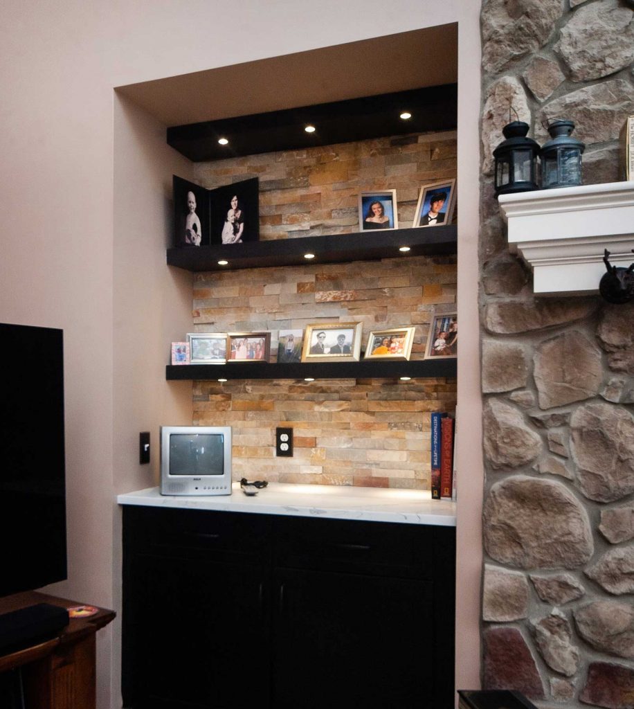 Built-in bookcases next to fireplace