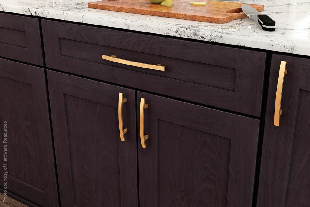Luxury kitchen dark wood cabinets with simple elegant gold pull handles