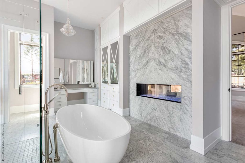 Luxury master suite with soaking tub and fireplace