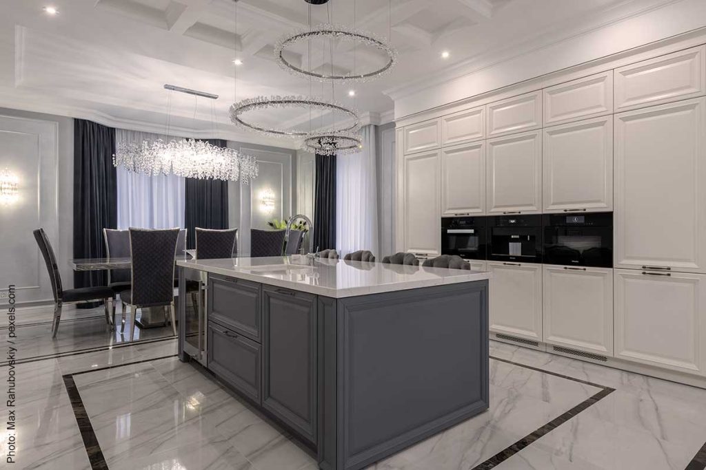 Luxury kitchen with large ring lights covered in crystals following the latest in kitchen trends