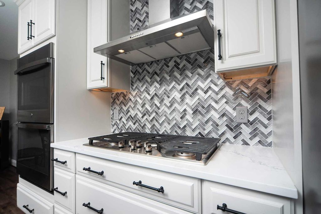 A kitchen trend for backsplashes is to mix up the pattern and no just use white subway tiles