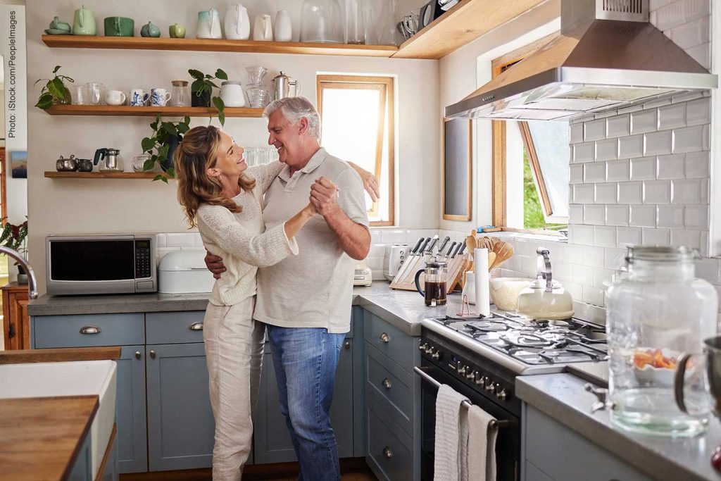Senior couple dancing in the kitchen