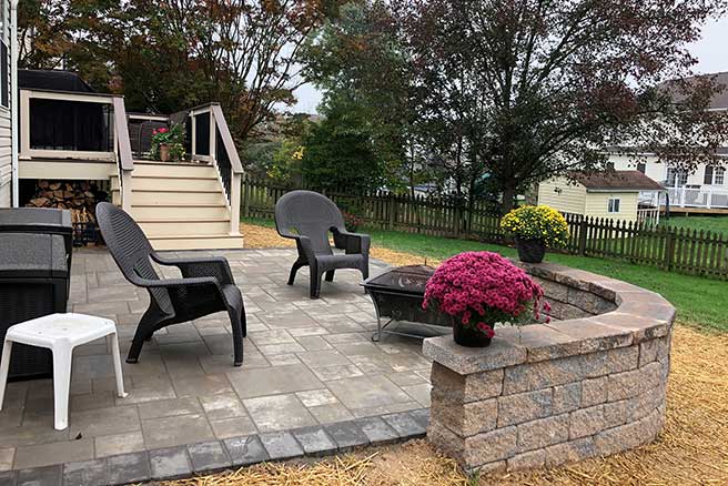 Stone patio with partial wall